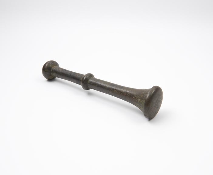 Bronze pestle with trumpet-like grinding end and large circular