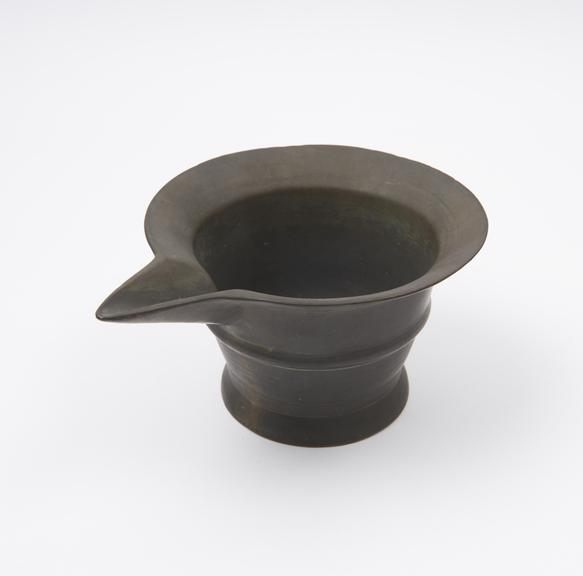 Small bronze mortar with high flared foot, flat base