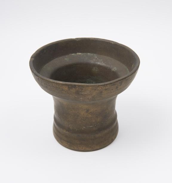 Tall bell-shaped mortar, wide flared rim, slightly flared foot