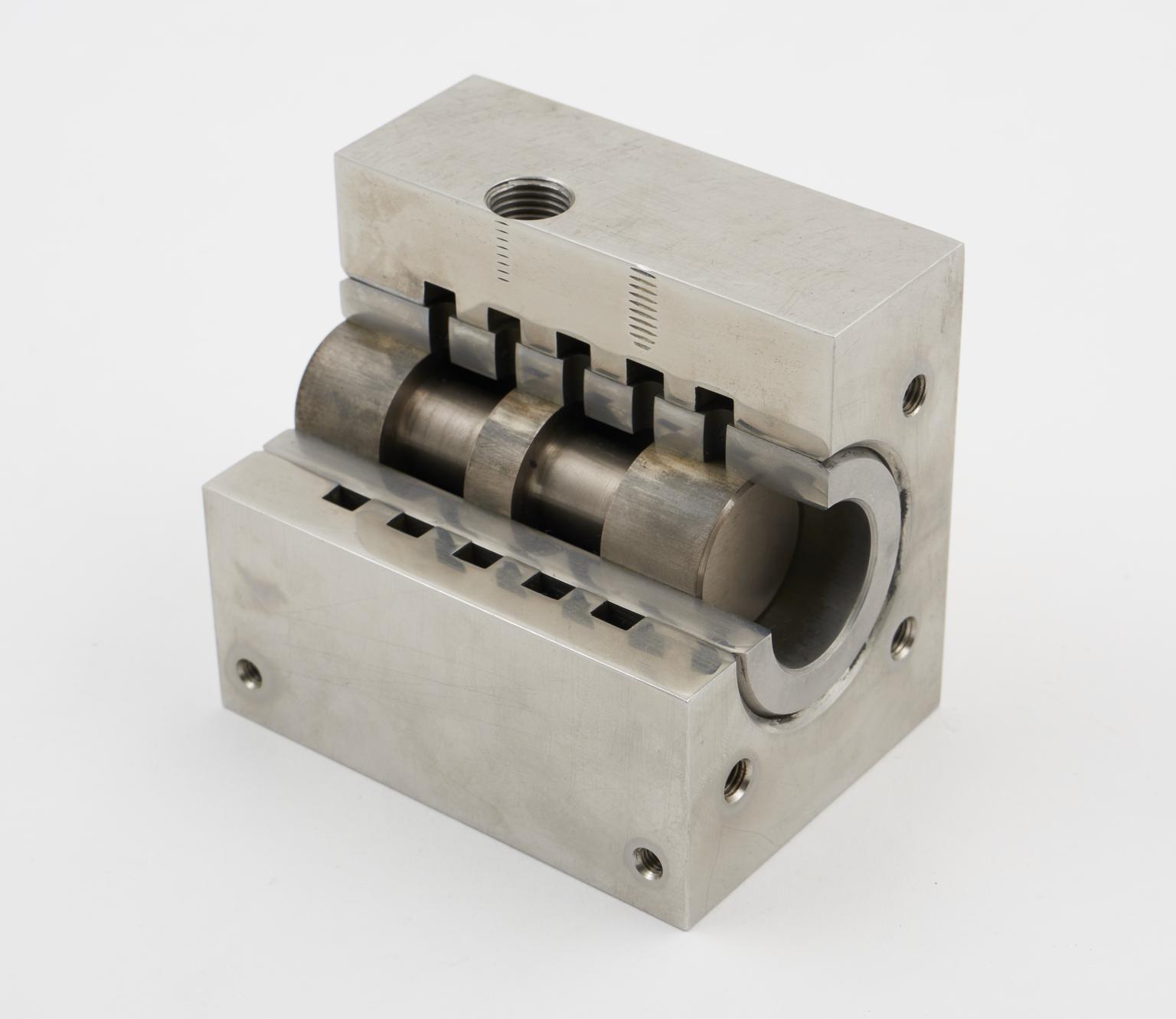 Sectioned model of water spool valve and liner