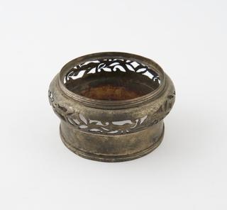 Part of brass lamp/burner with cut-out decoration