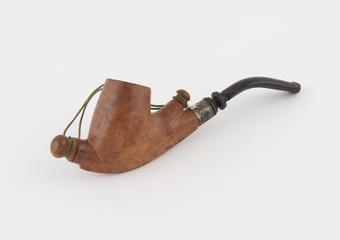 Wooden pipe with metal ferrule and string decoration