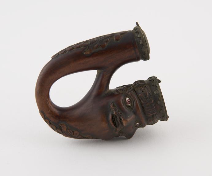 Carved wooden tobacco pipe, representing three male mask