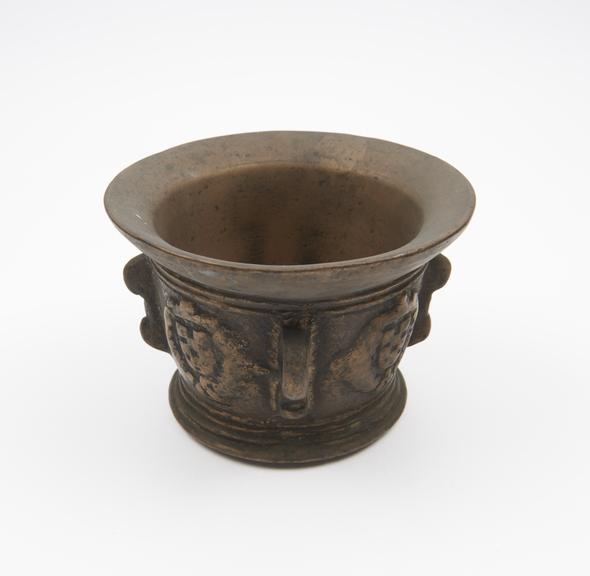 Small squat bronze mortar, wide flared rim