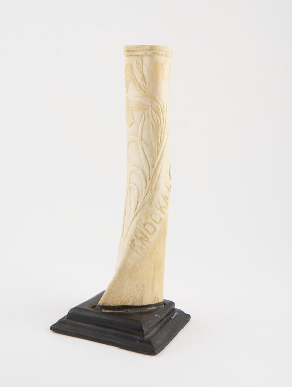 Bone ornament, set in a wooden stand, 1915