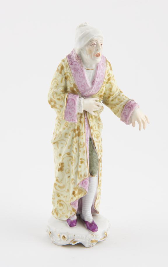 Porcelain figure of a sick man, marked, possibly Meissen