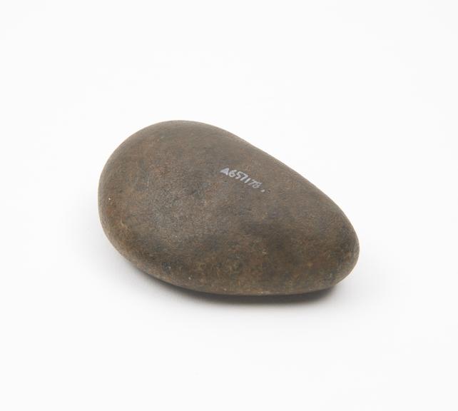 Solid stone pounder, smooth and roughtly pear-shaped