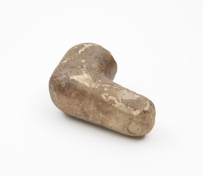 Carved stone pestle in form of a crooked finger