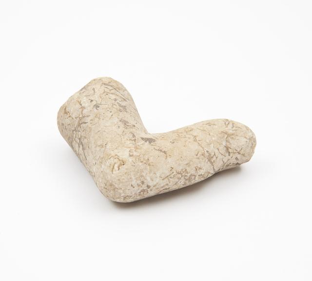 Carved marble pestle in form of a crooked finger, Roman