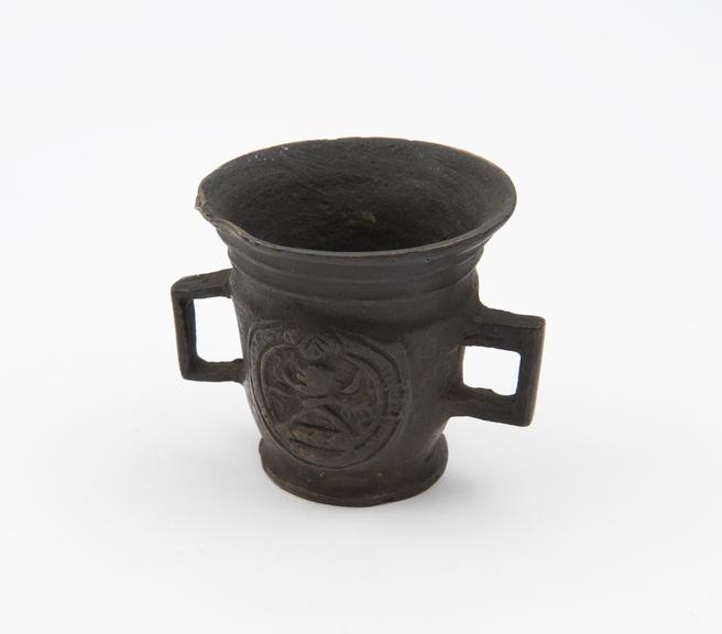 Small bronze mortar decorated with coat of arms