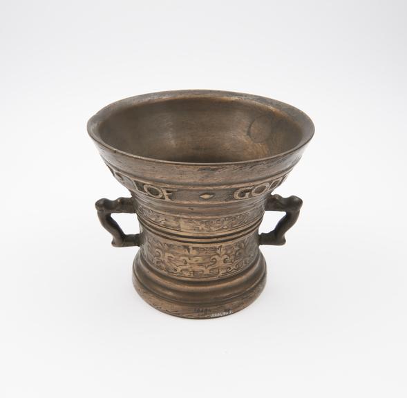 Large bell-shaped bronze mortar, flared rim and foot