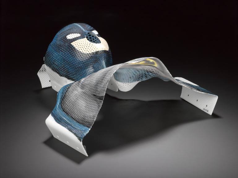 Thermoplastic mesh mask made for a child used to hold their