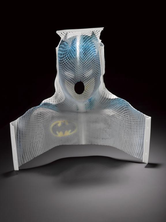 Thermoplastic mesh mask made for a child used to hold their