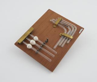 Seven glass tubes from blood transfusion apparatus