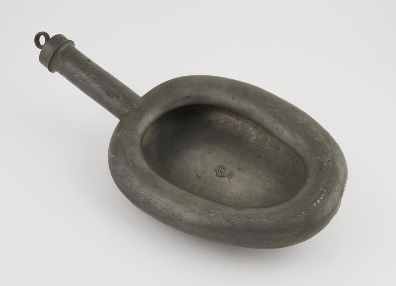 Small wedge shaped pewter bedpan with round rim