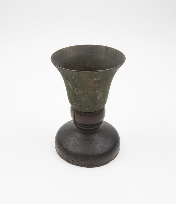 Mortar of brass with turned wooden base