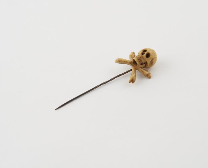 Metal hat or tie pin with an ivory knop in the form of a skull