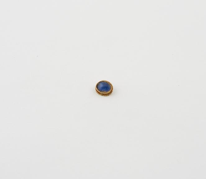 Gold setting possibly from a brooch, with blue glass centre