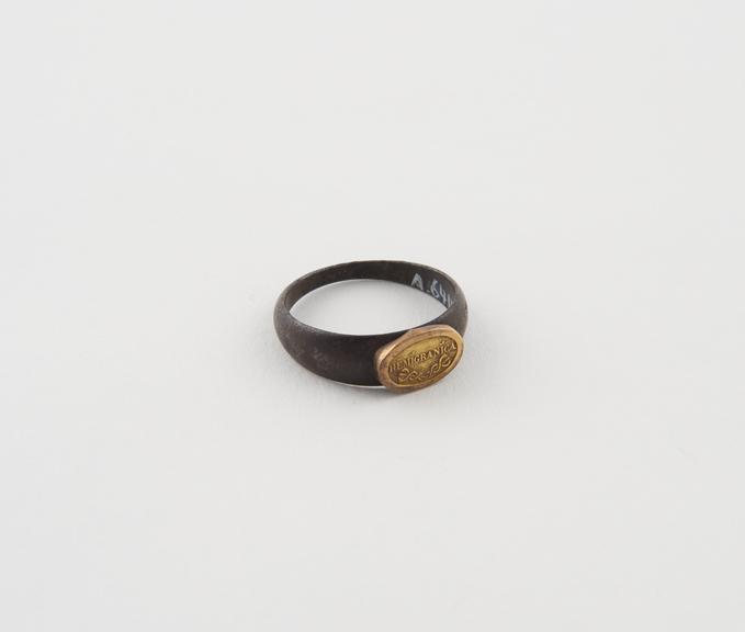 Metal finger ring, with oval bezel bearing inscription