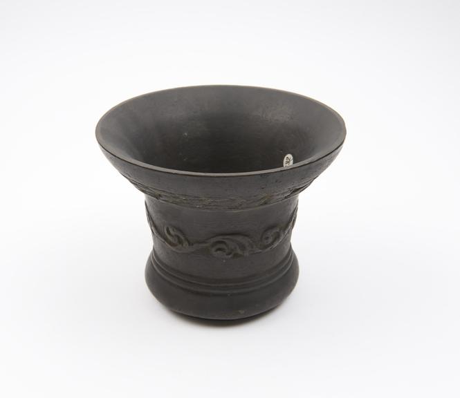 Small bell-shaped mortar, flared rim and pedestal base