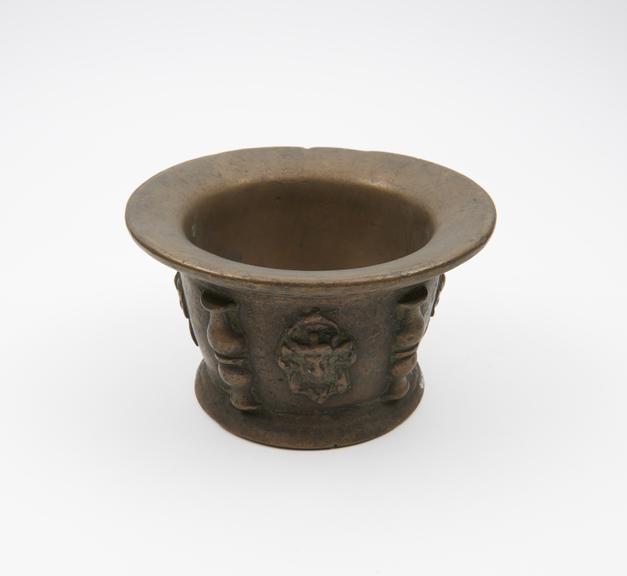 Small squat bronze mortar, wide flared rim, high flaring foot