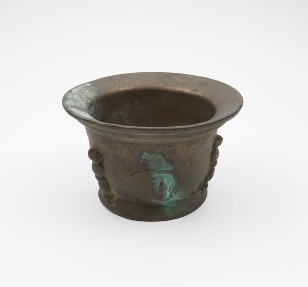 Small bronze mortar, everted rim and foot, flat base