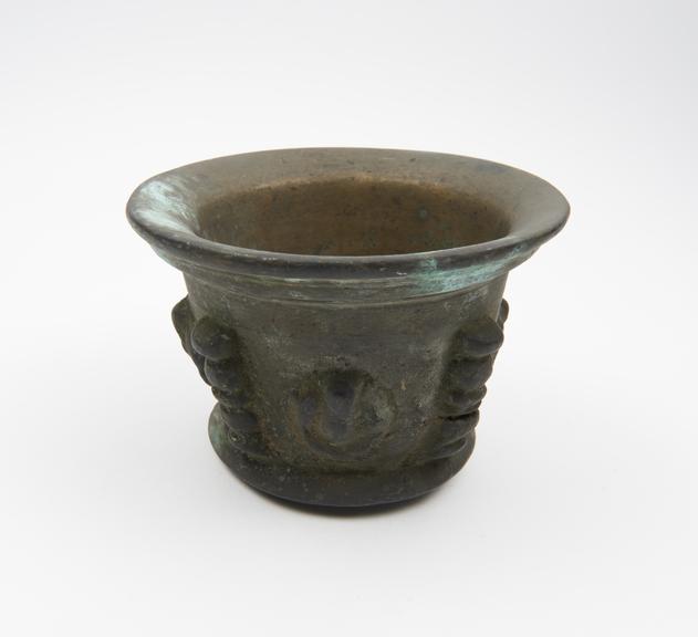 Squat bronze mortar, flared rim and foot, flat base