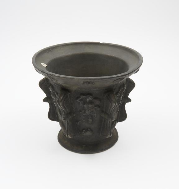 Tall bell-shaped mortar, wide flared rim and flared foot