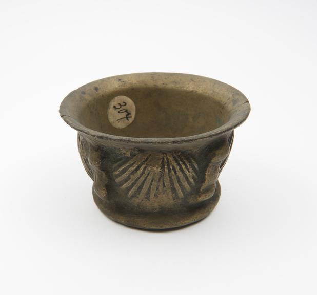 Small brass (?) mortar, moulded foot, flared rim