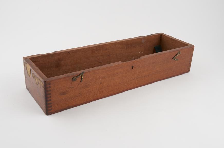 Part of a wooden case for an unidentified instrument