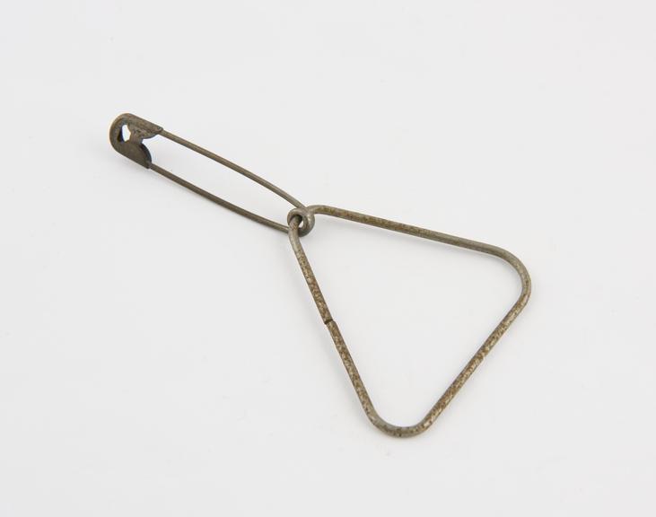 Safety pin, with metal triangle frame attached to it