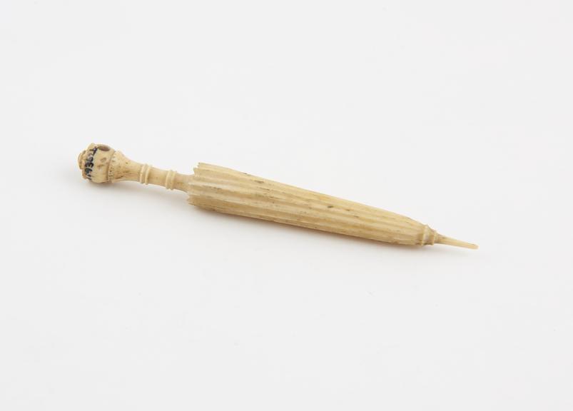 Bone needle case carved in the form of a parasol