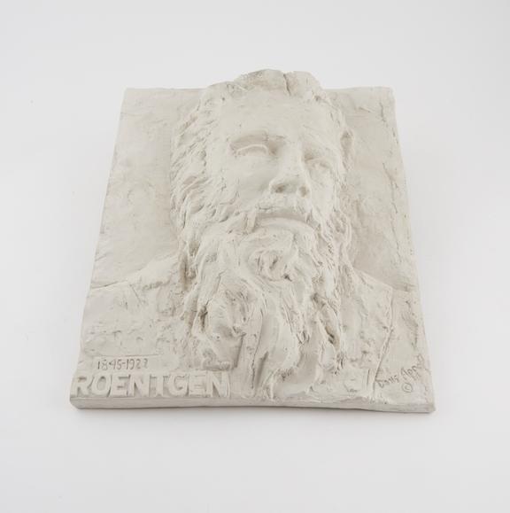 Relief plaque of Roentgen by Doris Appel, plaster of paris, 1958