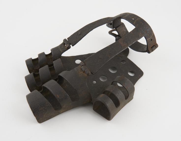 Iron hand cage, used for knuckle breaking and heat torture