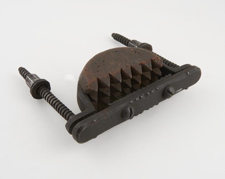 Hand crusher, with toothed pads, iron and wood, possibly Swiss