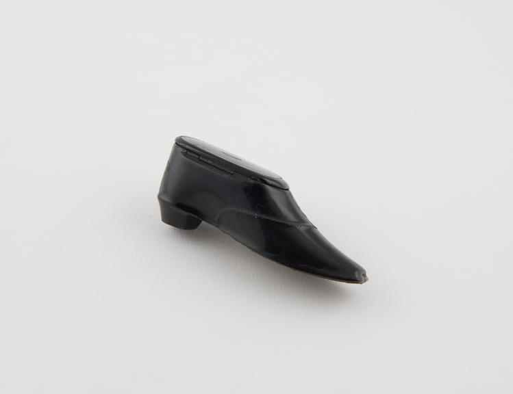 Papier mache snuff box in the form of a black shoe, hinged lid