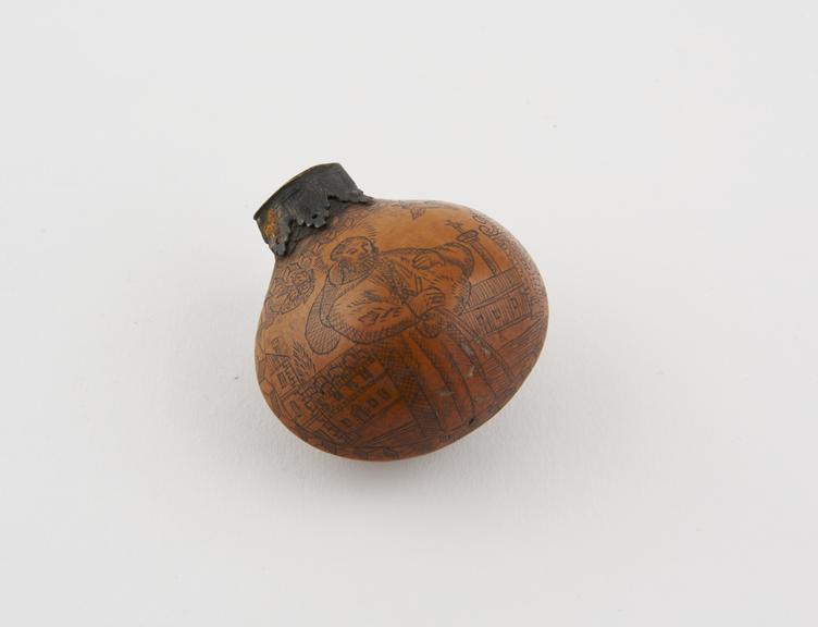 Small snuff flask or perfume flask made of an oval nut shell