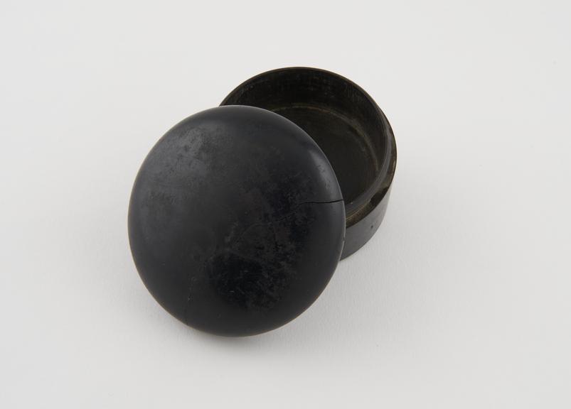 Black, circular, wooden box, possibly for snuff, screw on lid