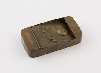 Oblong brass snuff box with hinged lid on broken combination lock in form of two dials