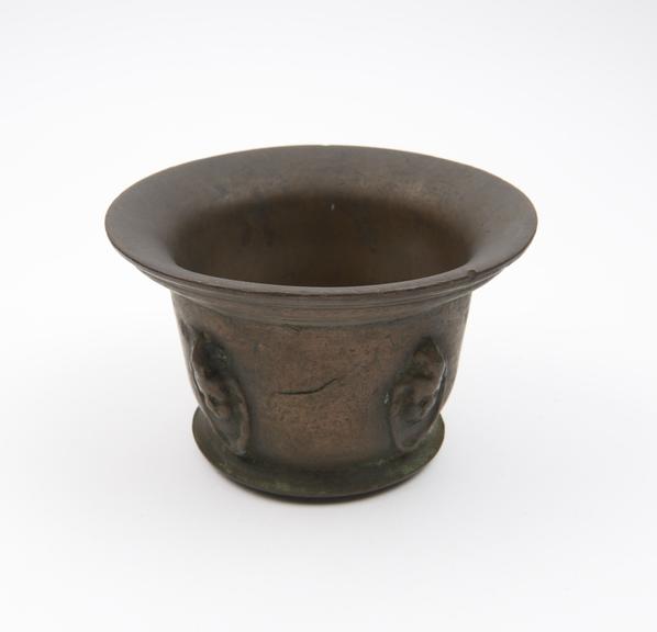 Small squat bronze mortar, wide  flared rim and foot