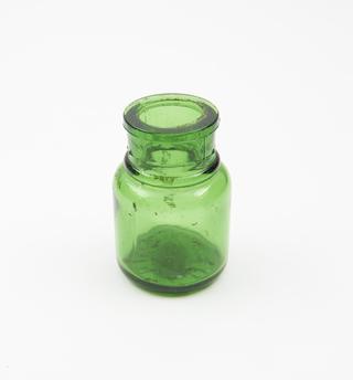 Green glass dispensing bottle