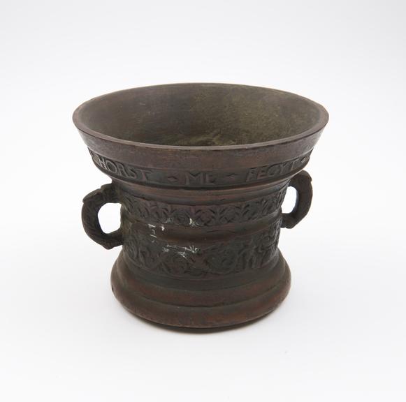 Bell-shaped bronze mortar, flared and inscribed rim