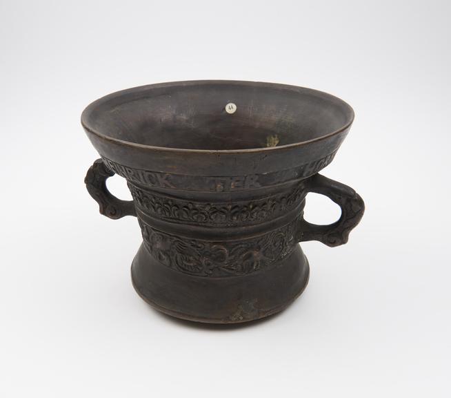 Bronze bell shaped mortar, everted rim