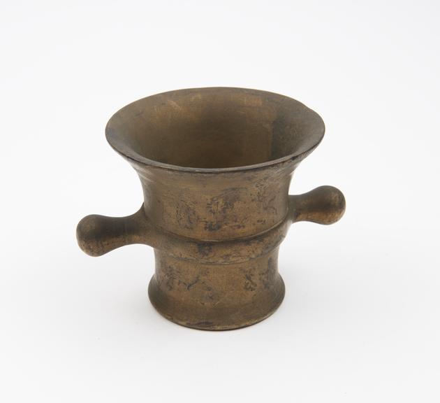 Small bell-shaped brass mortar
