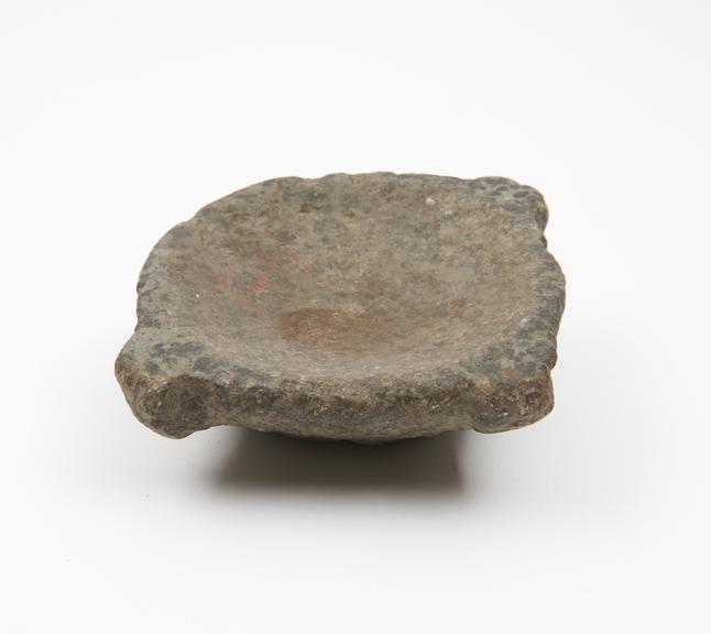 Small granite mortar with uneven base