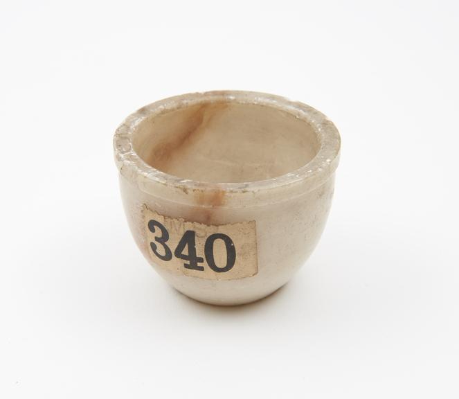 Cup-shaped polished stone mortar
