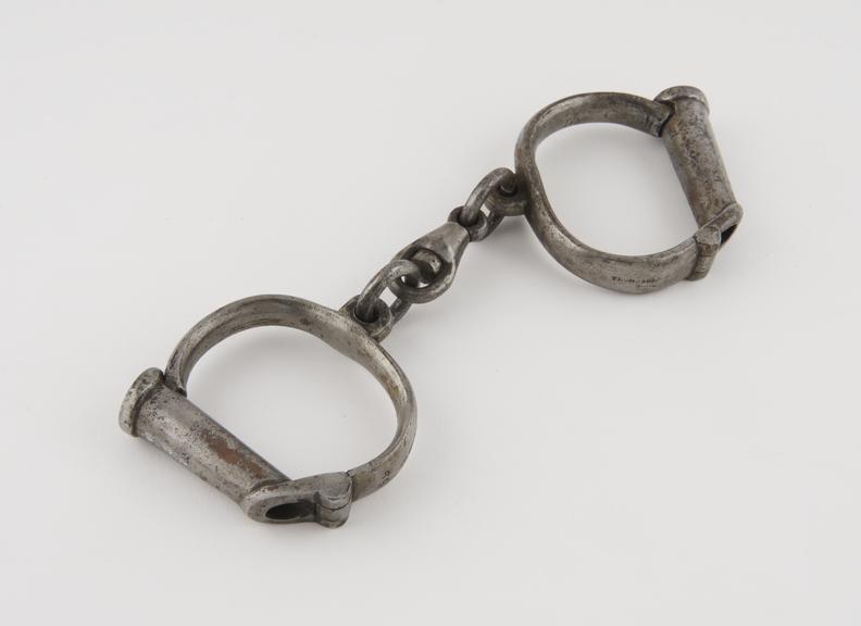 Handcuffs, iron, by Thompson, English, 19th century