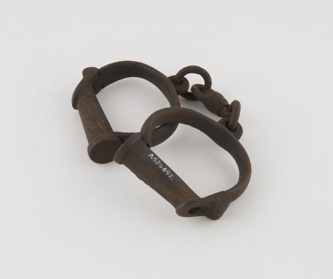 Pair of handcuffs, English, 19th century