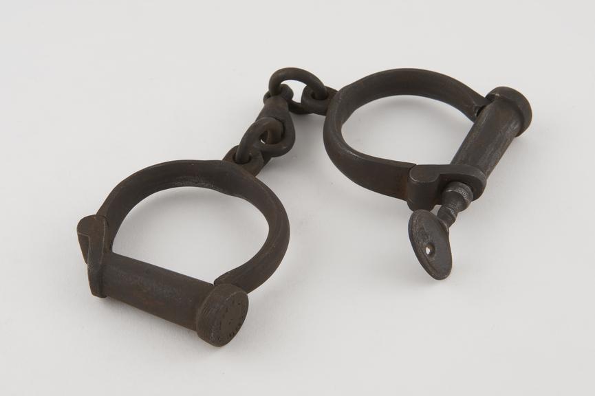 Pair of handcuffs, by Hiatt, English, 19th century