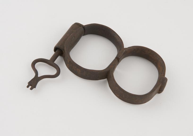 Handcuffs, with key, English, 1750-1850